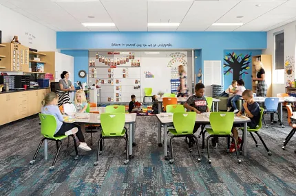 Vibrant carpet flooring for educational spaces Modern classroom with colorful chairs and patterned carpet flooring
