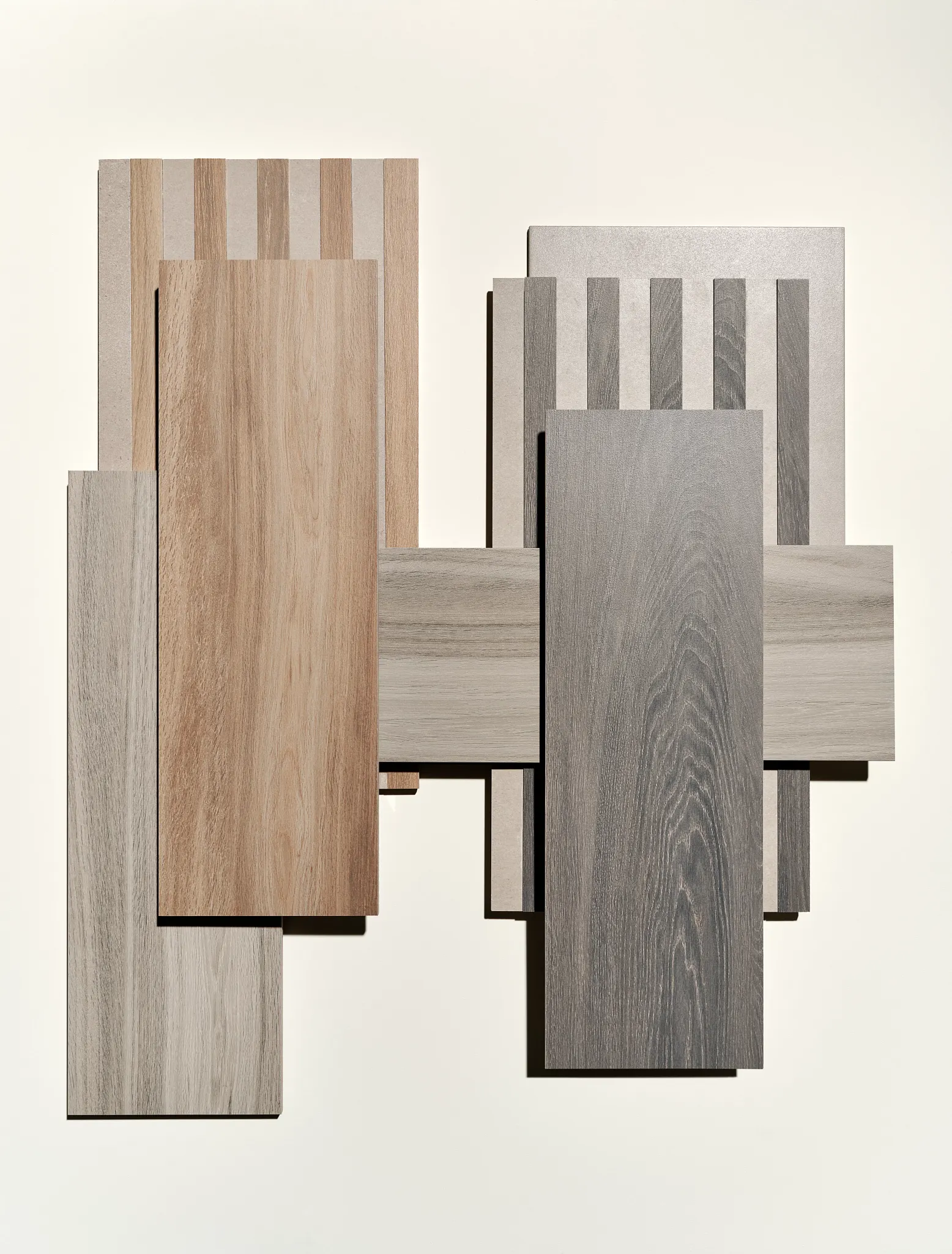 Assorted porcelain tile samples in neutral tones