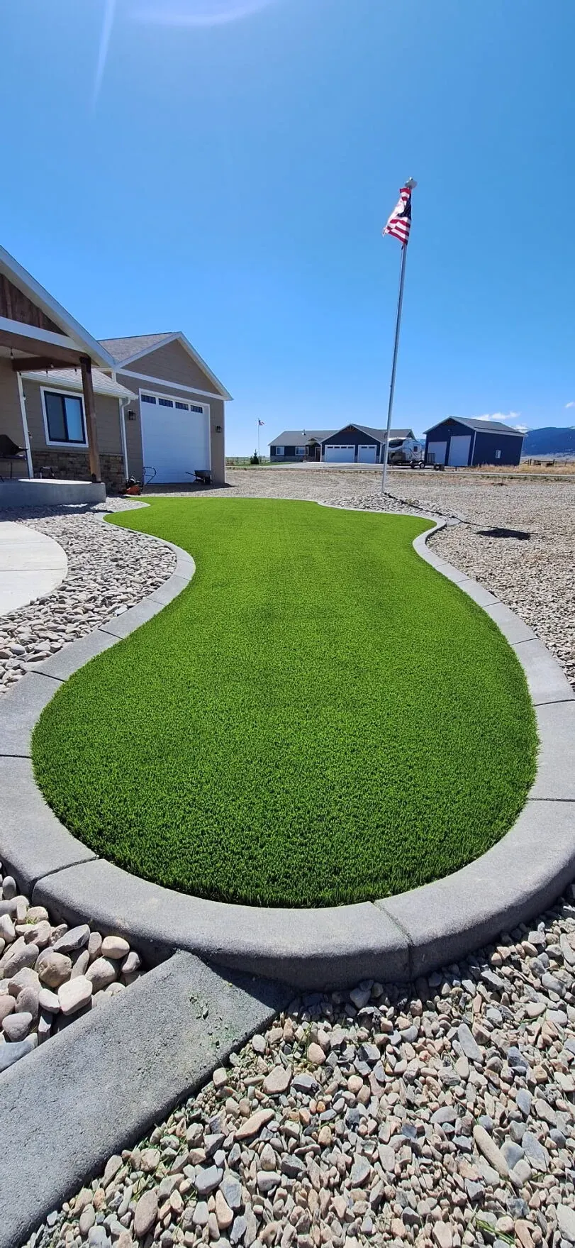 Artificial grass lawn in residential front yard