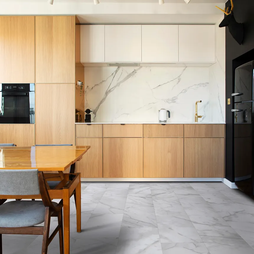 Marble-look Luxury Vinyl Tile Flooring in Modern Kitchen - Coretec Mineral Core kitchen with marble-look luxury vinyl tile floor in white and gray with Mineral Core construction