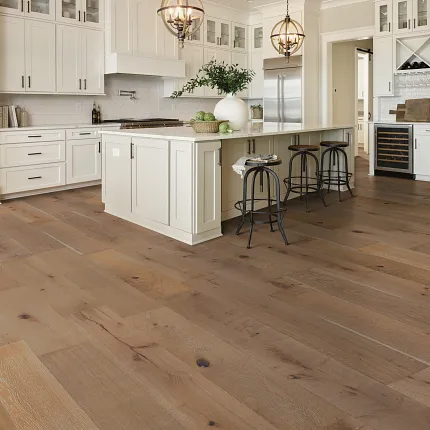 Light Oak Engineered Hardwood Flooring in Contemporary Kitchen Setting Modern kitchen with light oak engineered hardwood flooring, white cabinetry, and pendant lighting