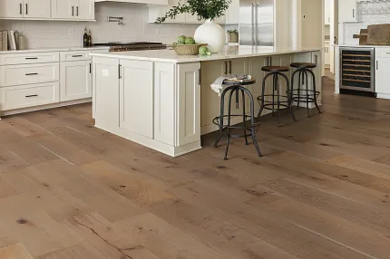 Light Oak Engineered Hardwood Flooring in Contemporary Kitchen Setting Modern kitchen with light oak engineered hardwood flooring, white cabinetry, and pendant lighting