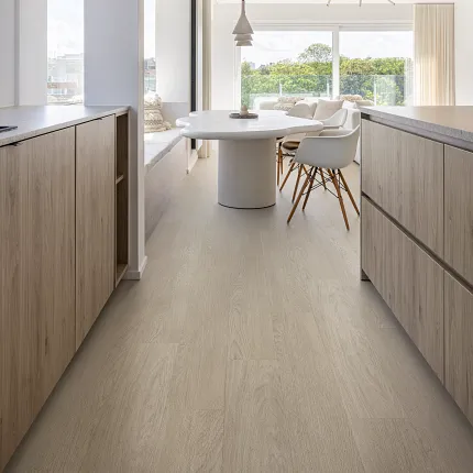 Light Wood Look LVP Flooring in Contemporary Dining Space Modern dining area with light wood look luxury vinyl plank flooring and black leather chairs