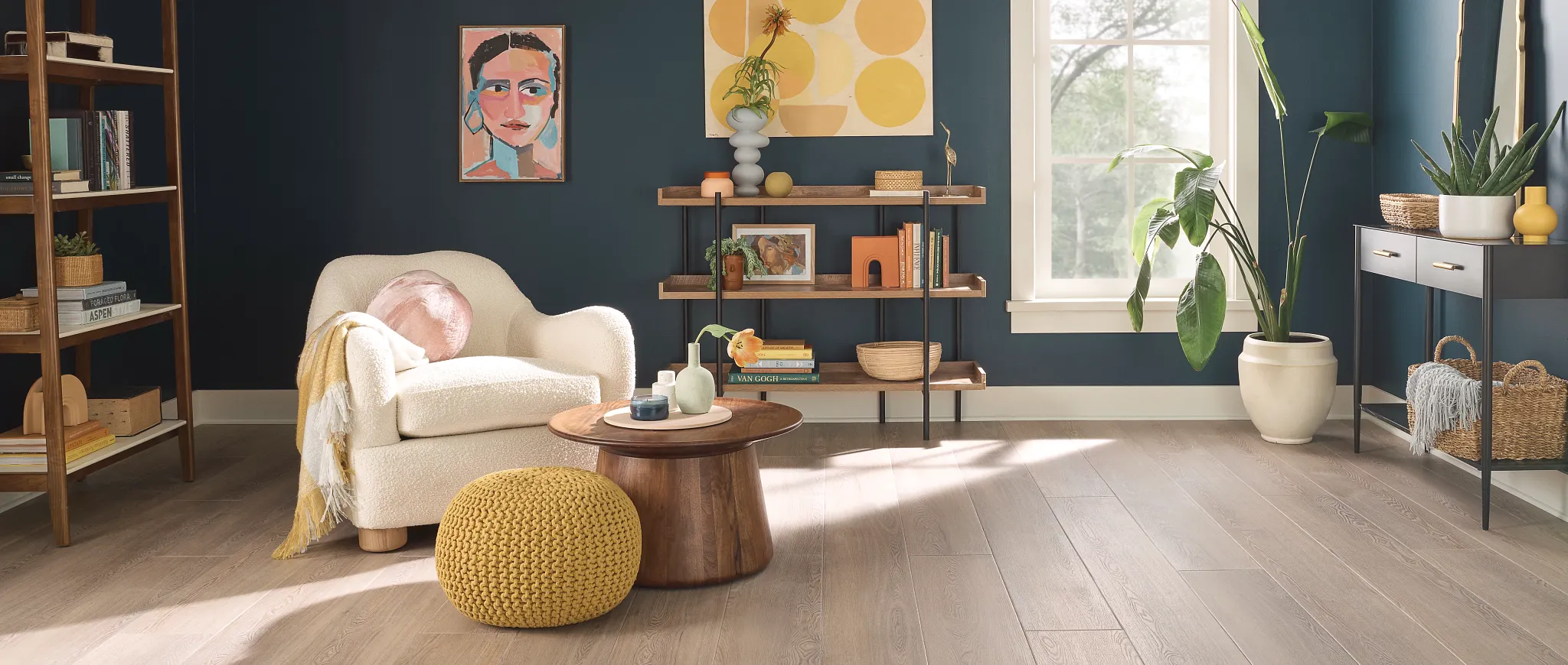 living room with luxury vinyl plank floor in a light wood look with a armchair wooden coffee table and decorative plants