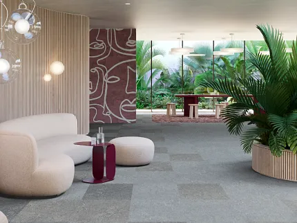Contemporary lounge with commercial carpet tile flooring and stylish decor Modern lounge area with plush seating and large potted plants on commercial carpet tile flooring
