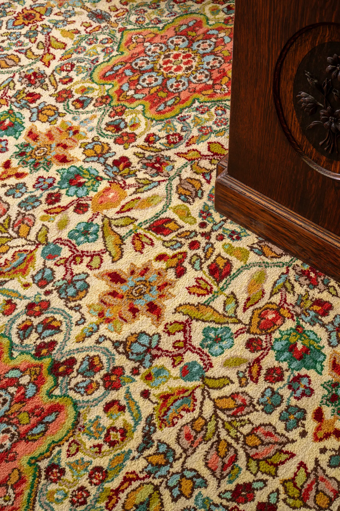 Colorful floral carpet with red, blue, green, and yellow patterns