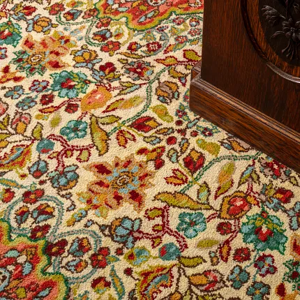 Vibrant patterned carpet for elegant interiors Colorful floral carpet with red, blue, green, and yellow patterns