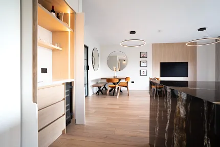 Stylish light wood flooring in a modern dining room Modern dining area with light wood flooring and contemporary decor