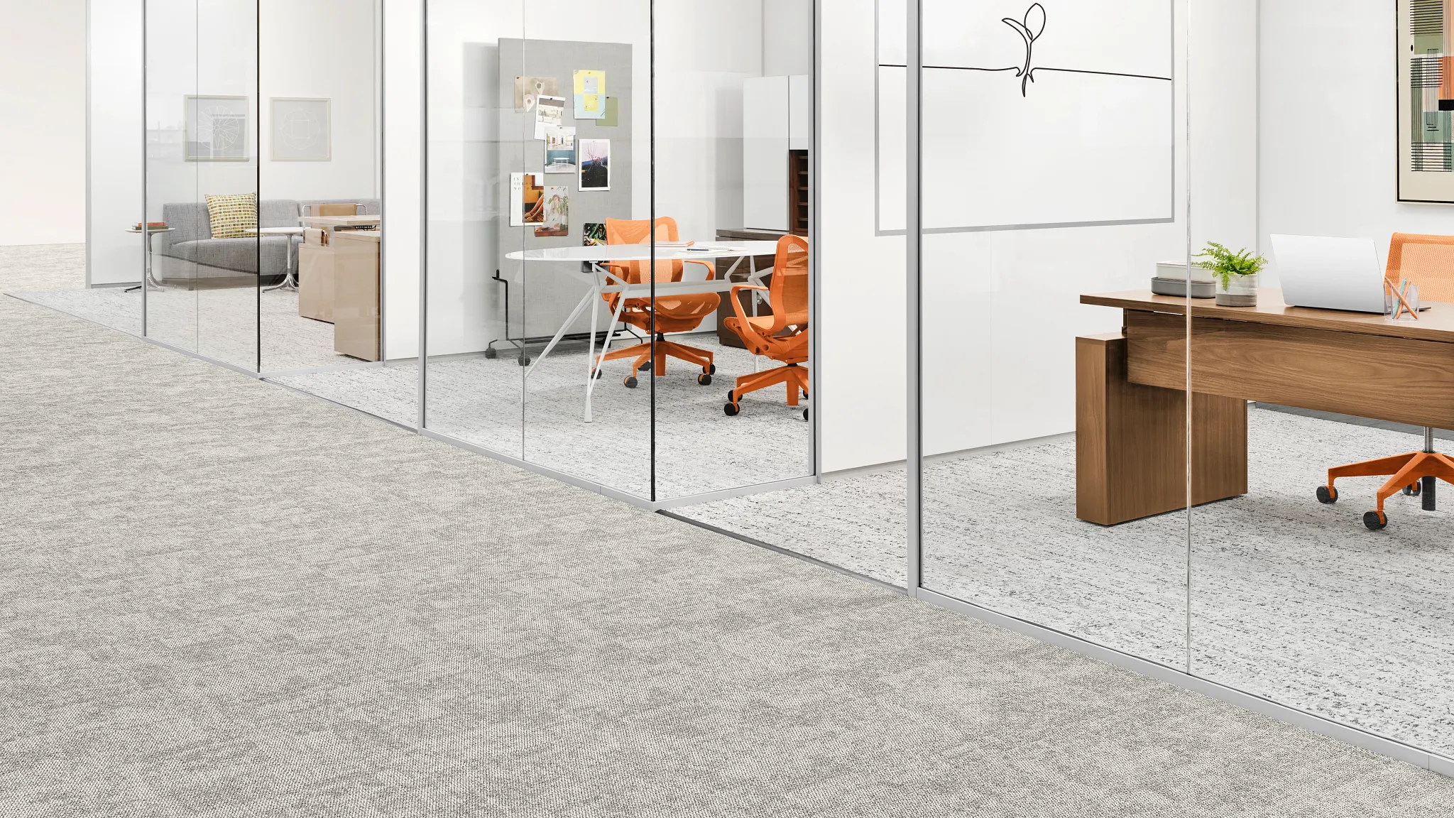 Hallway with grey carpet tile and three private offices