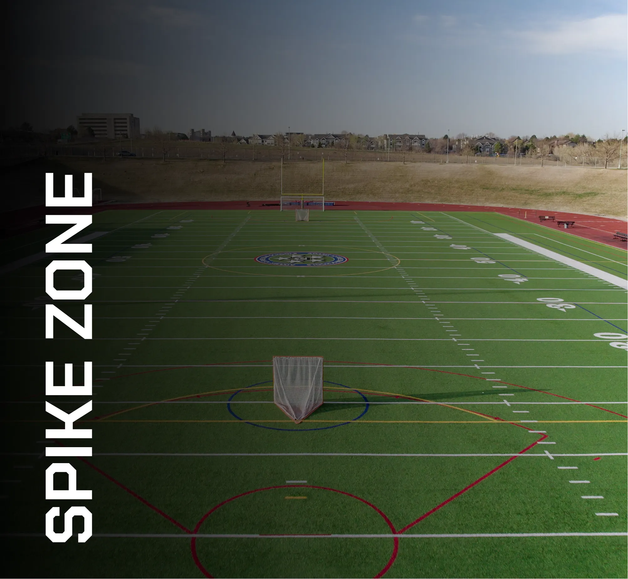 Artificial turf field with sports markings and goal post