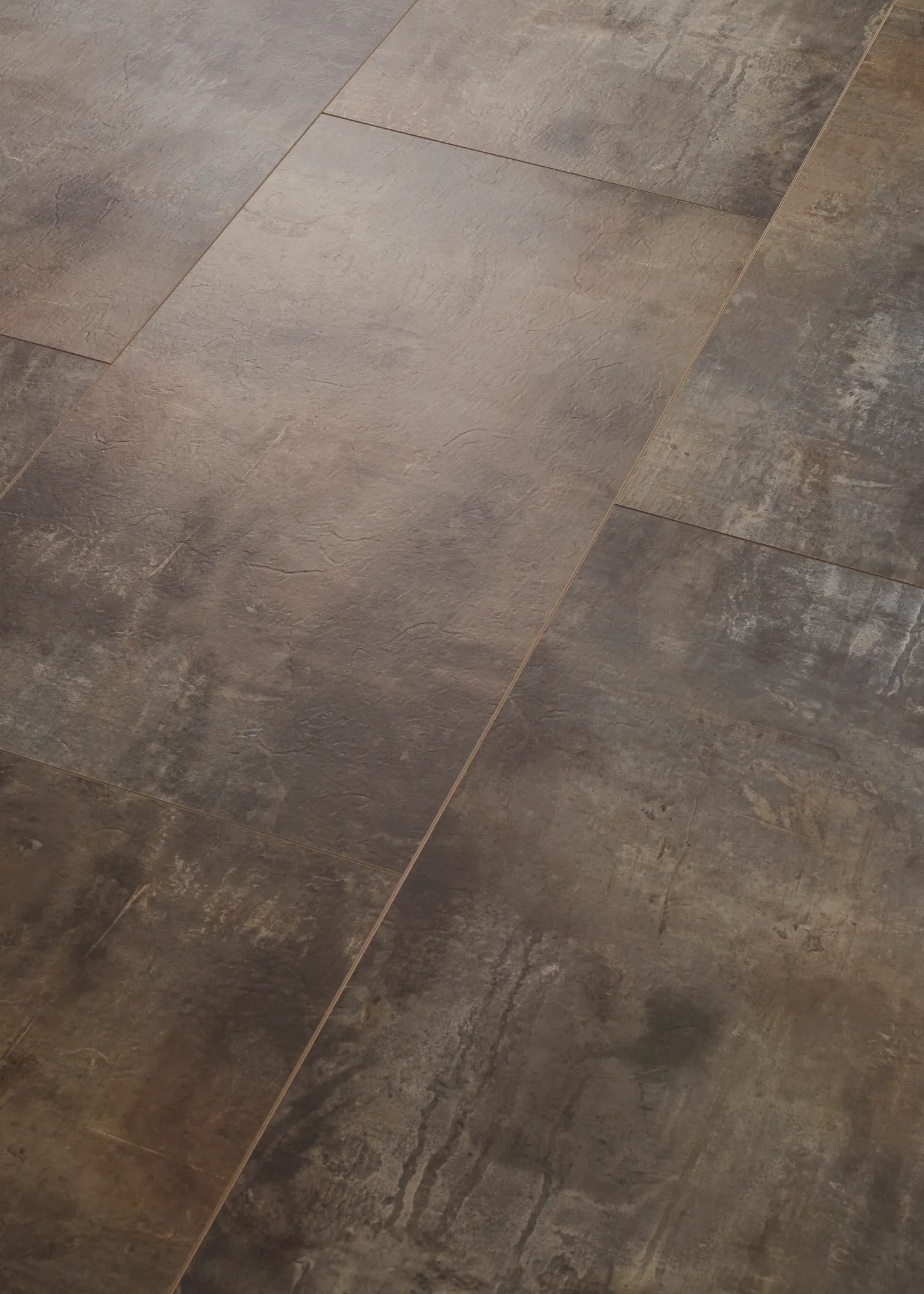 Luxury vinyl tile floor with a stone look in shades of brown and gray