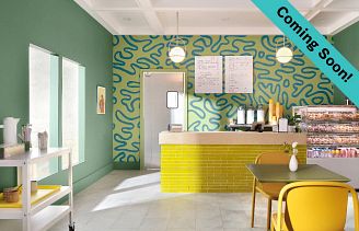 vibrant snack bar featuring bright greens and neons yellow with marble look COREtec vinyl floor