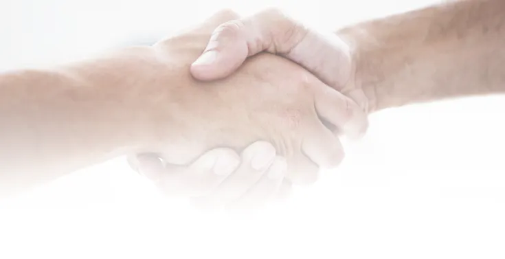 Two people shaking hands on a white background