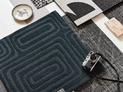 Stylish carpet designs for modern interiors Assorted carpet swatches in black, white, and dark teal