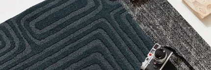 Stylish carpet designs for modern interiors Assorted carpet swatches in black, white, and dark teal