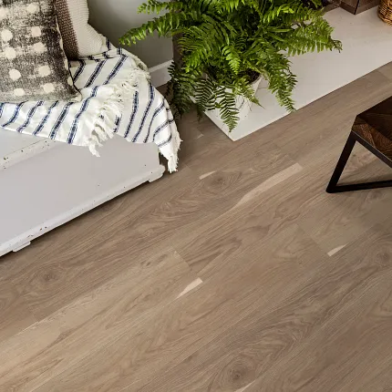 Engineered Hardwood Flooring for Everyday Comfort and Style Cozy living room with engineered hardwood flooring featuring a natural wood grain pattern