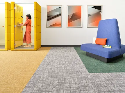 Vibrant carpet tile design for educational spaces Modern education facility with yellow, gray, and green carpet tiles
