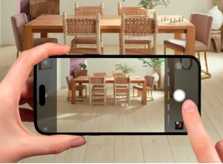 Modern dining room with wood look luxury vinyl plank flooring and smartphone capturing the scene