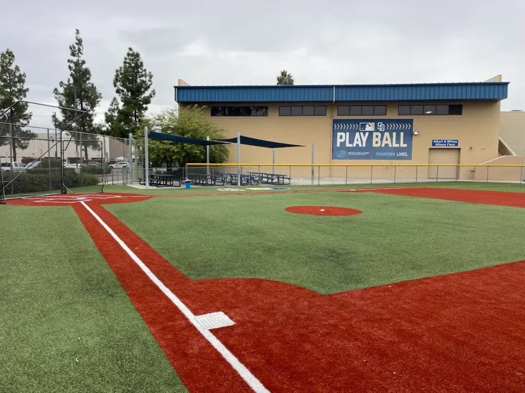 Baseball field with artificial turf and red clay markings