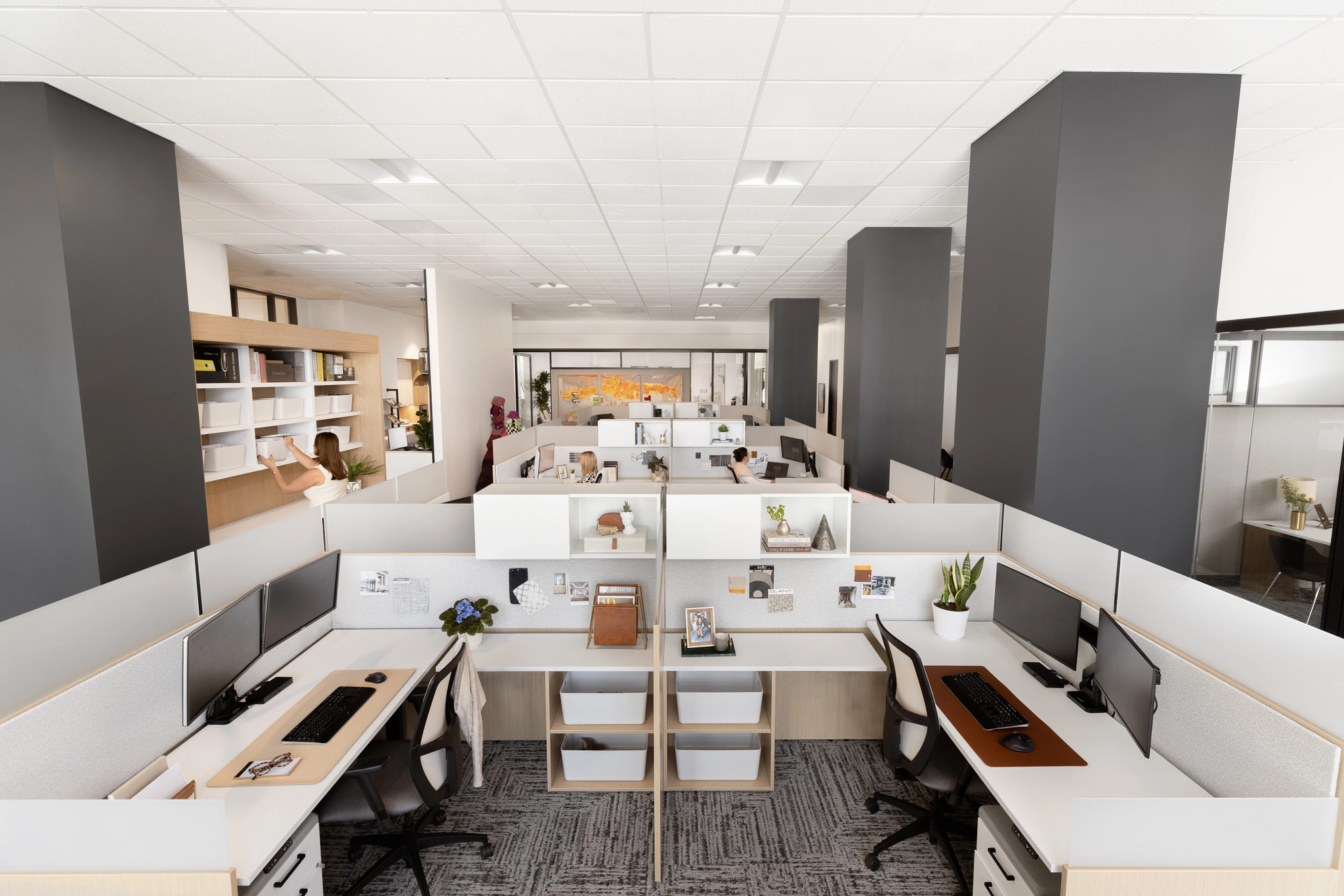 Modern office workspace with cubicles and commercial carpet tile flooring