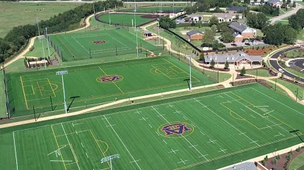 Artificial turf sports fields aerial view Aerial view of sports fields with artificial turf featuring various markings and logos