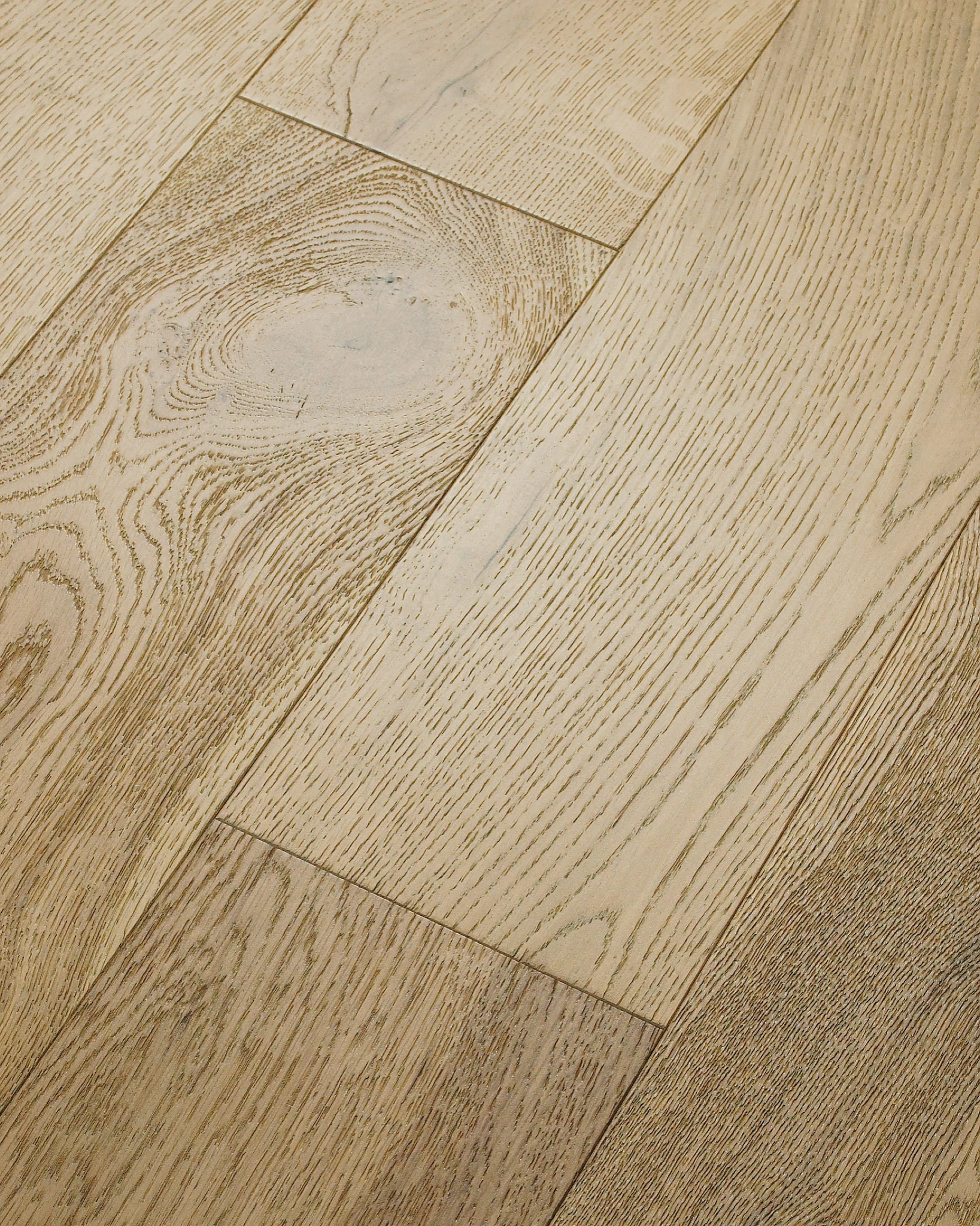 Close-up of light oak hardwood flooring with natural grain pattern