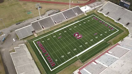 Football stadium with artificial turf and team logos Aerial view of a football stadium with artificial turf featuring "Bulldogs" and "SC State" logos
