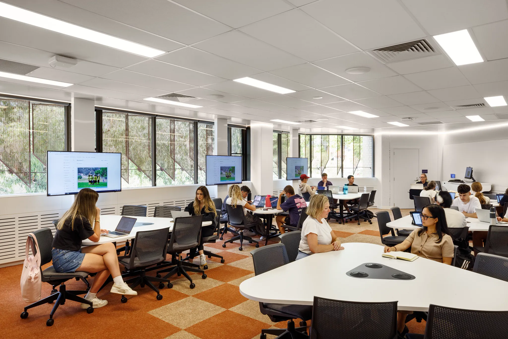 Modern classroom with orange and beige checkered carpet flooring