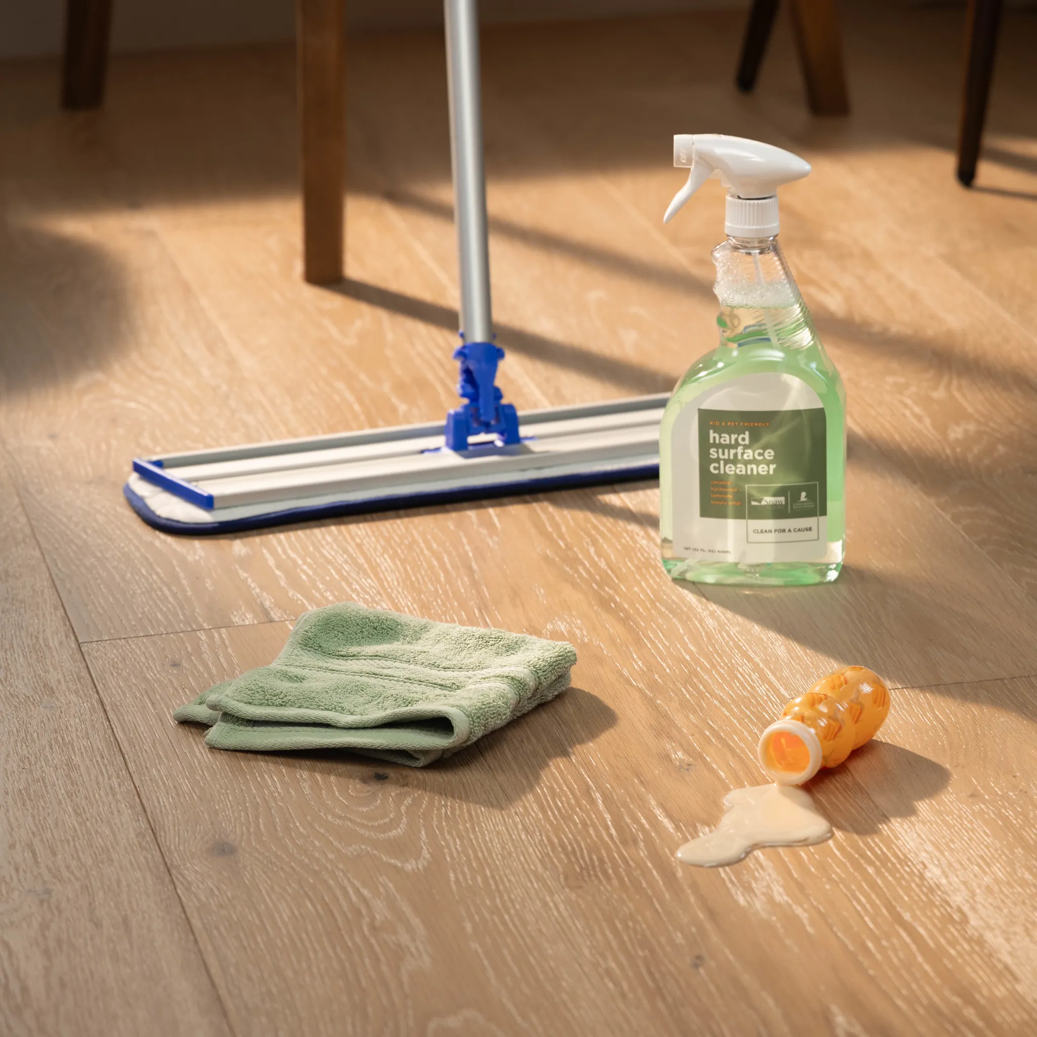 A hard surface flooring cleaner spray bottle