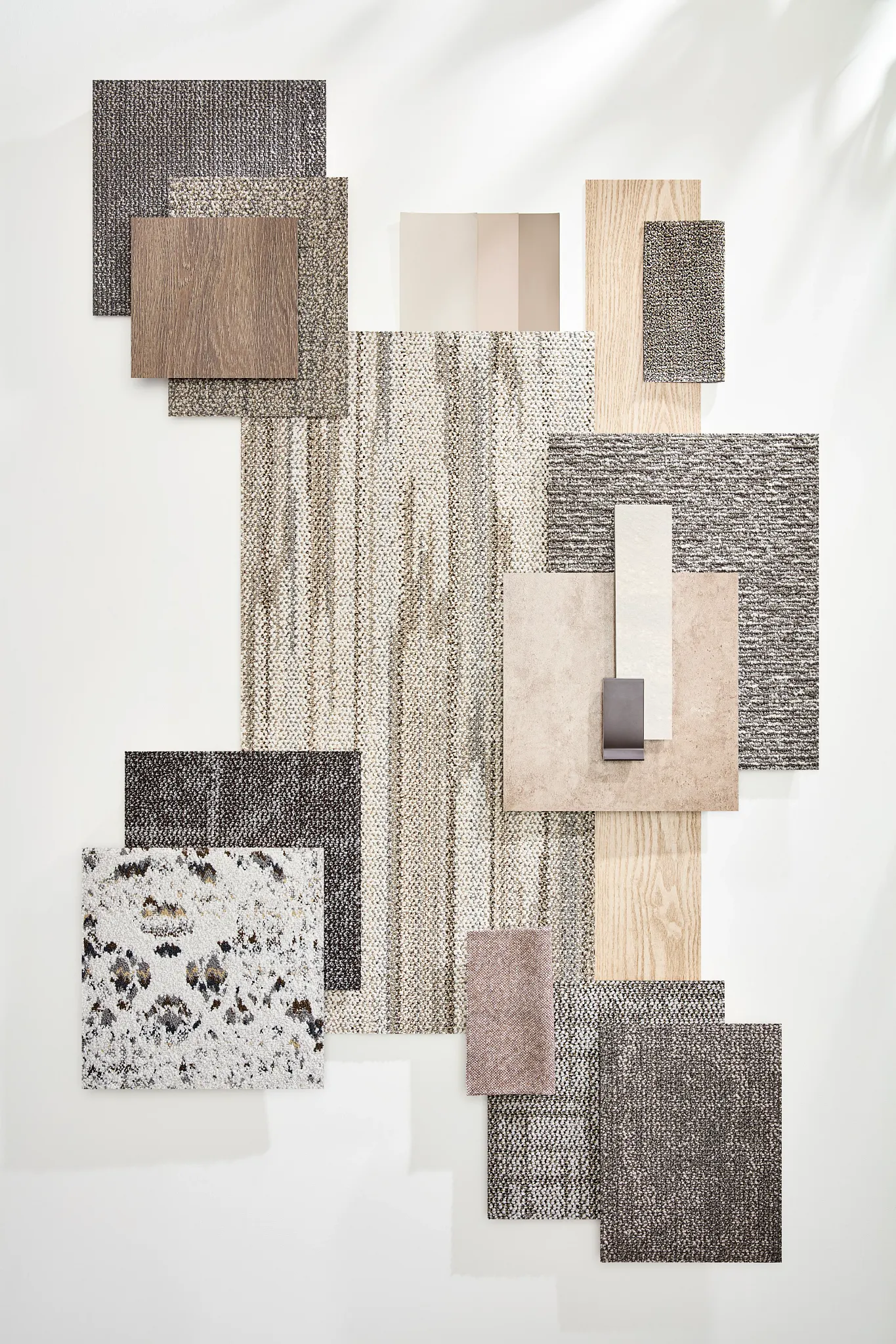 Assorted flooring swatches in neutral and textured designs