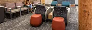 Stylish flooring for contemporary commercial spaces Modern waiting area with textured flooring and wooden wall accents