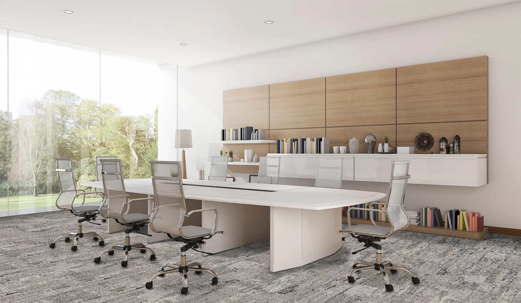Modern office space with large windows, white desks, and ergonomic chairs on gray commercial carpet tile