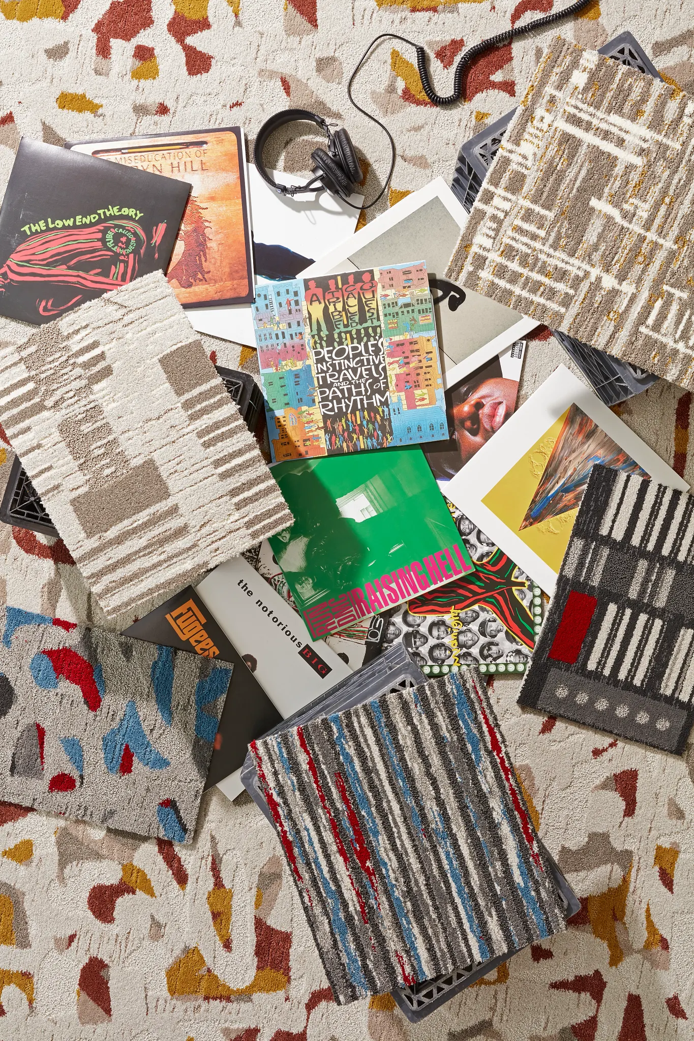 Assorted commercial carpet tile samples with vibrant patterns and colors