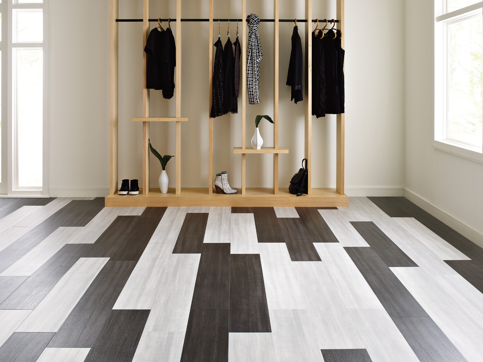 
  "Modern retail space with luxury vinyl plank flooring in shades of black, gray, and white"
)
