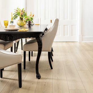 Image of part of a dining room table and chairs sitting on a COREtec floor