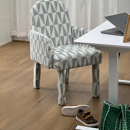 Coretec Residential SPC LVP Flooring in Home Office Scene Modern home office with geometric patterned chair on Coretec Residential SPC luxury vinyl plank flooring