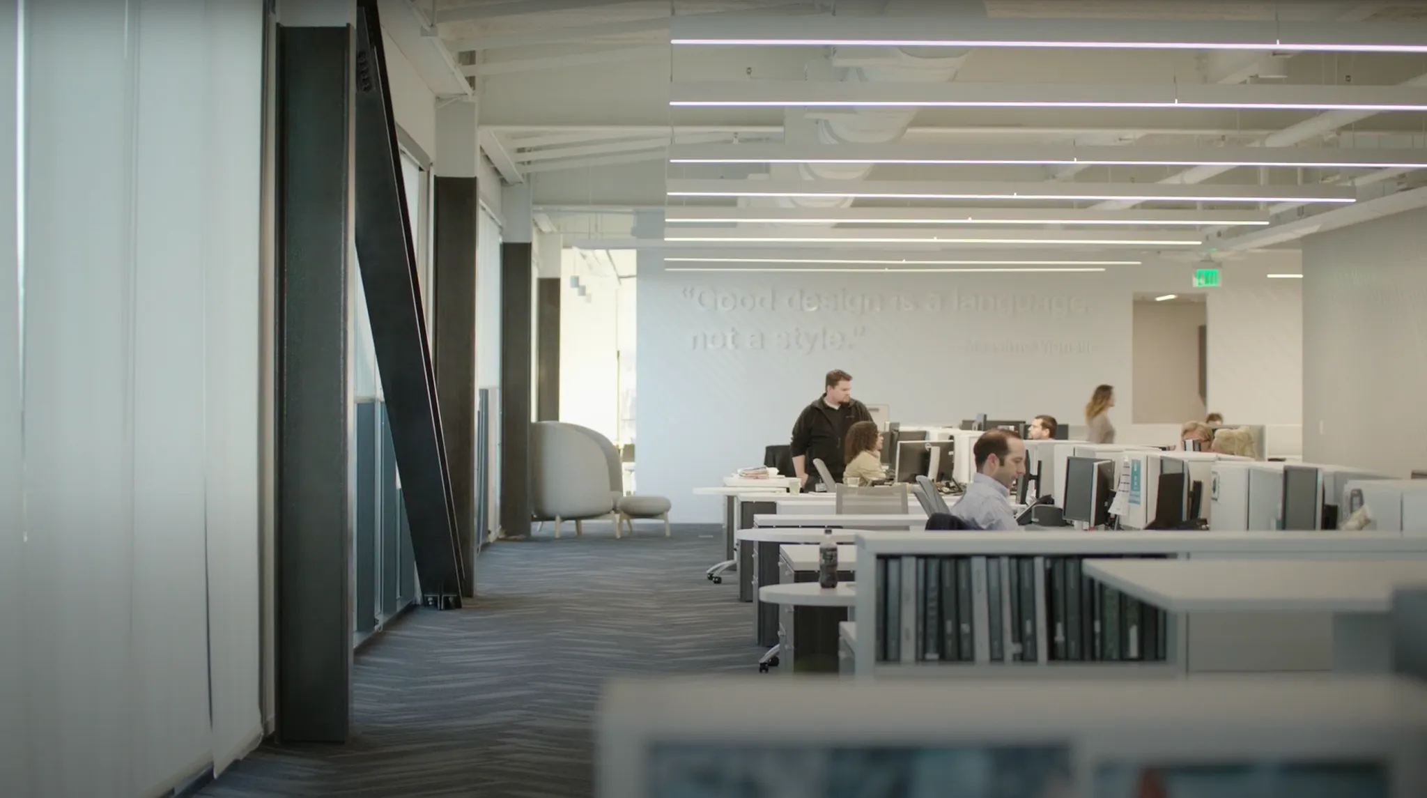 Modern workplace with open office layout featuring commercial carpet tile flooring
