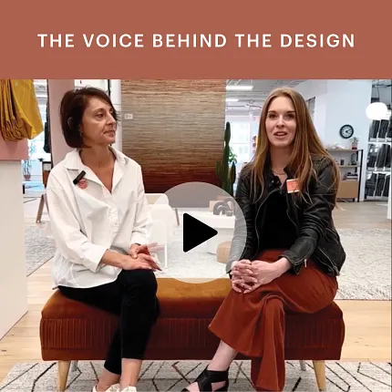 Modern Office Design with Contemporary Decor and Seating Two women sitting on a brown bench in a modern office setting with a patterned rug and contemporary decor