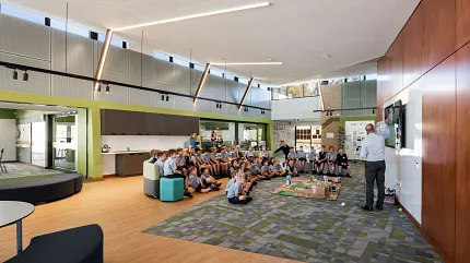 Education Facility with Commercial Carpet Tile and Wood-Look Flooring Education facility with students seated on patterned carpet tiles and wood-look flooring