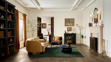 Elegant Living Room with Durable Engineered Hardwood Flooring for Everyday Comfort Cozy living room with engineered hardwood flooring, featuring a beige sofa, dark green rug, and elegant decor