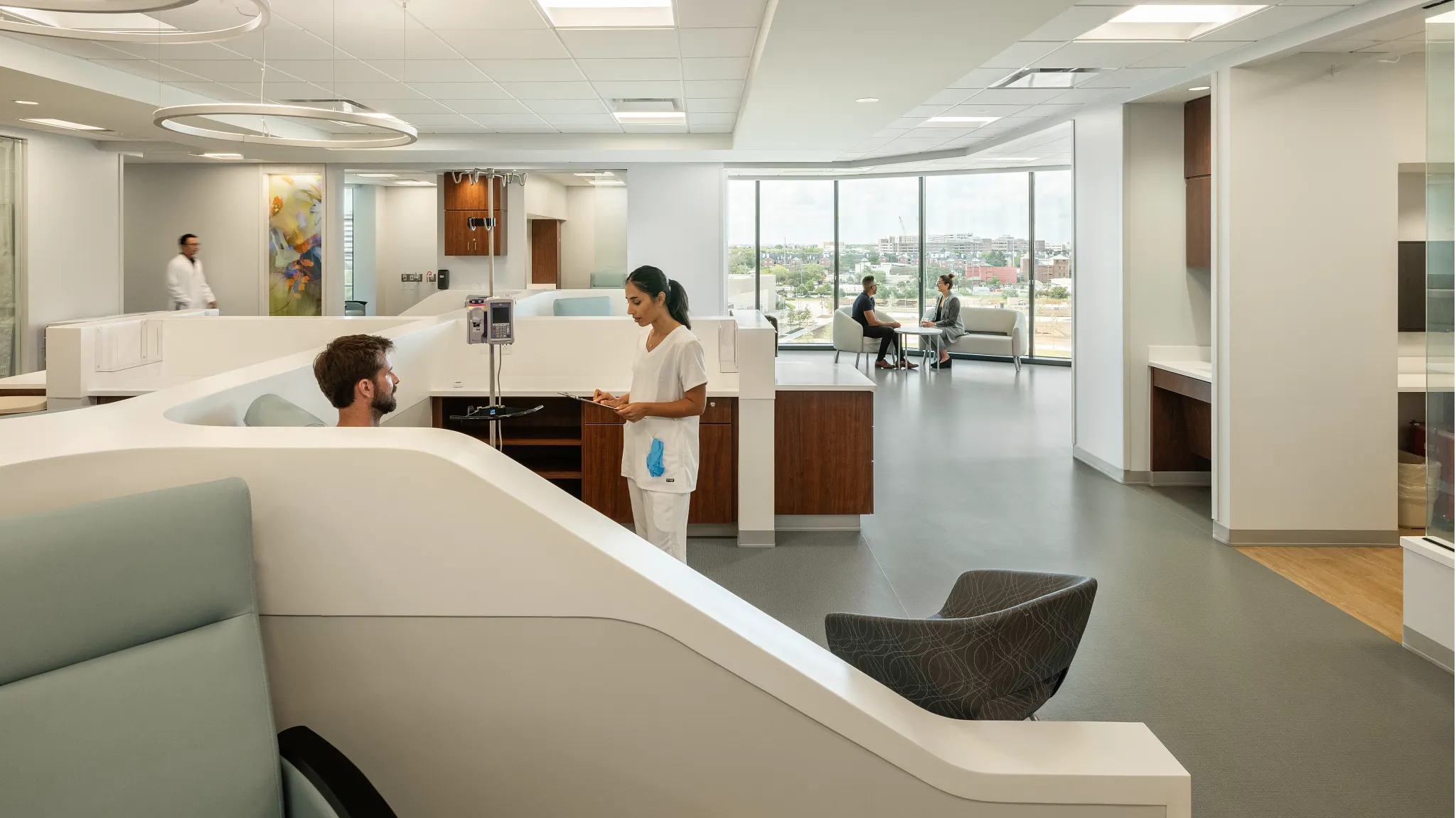 A nurse taking care of her patients in an IV Infusion room