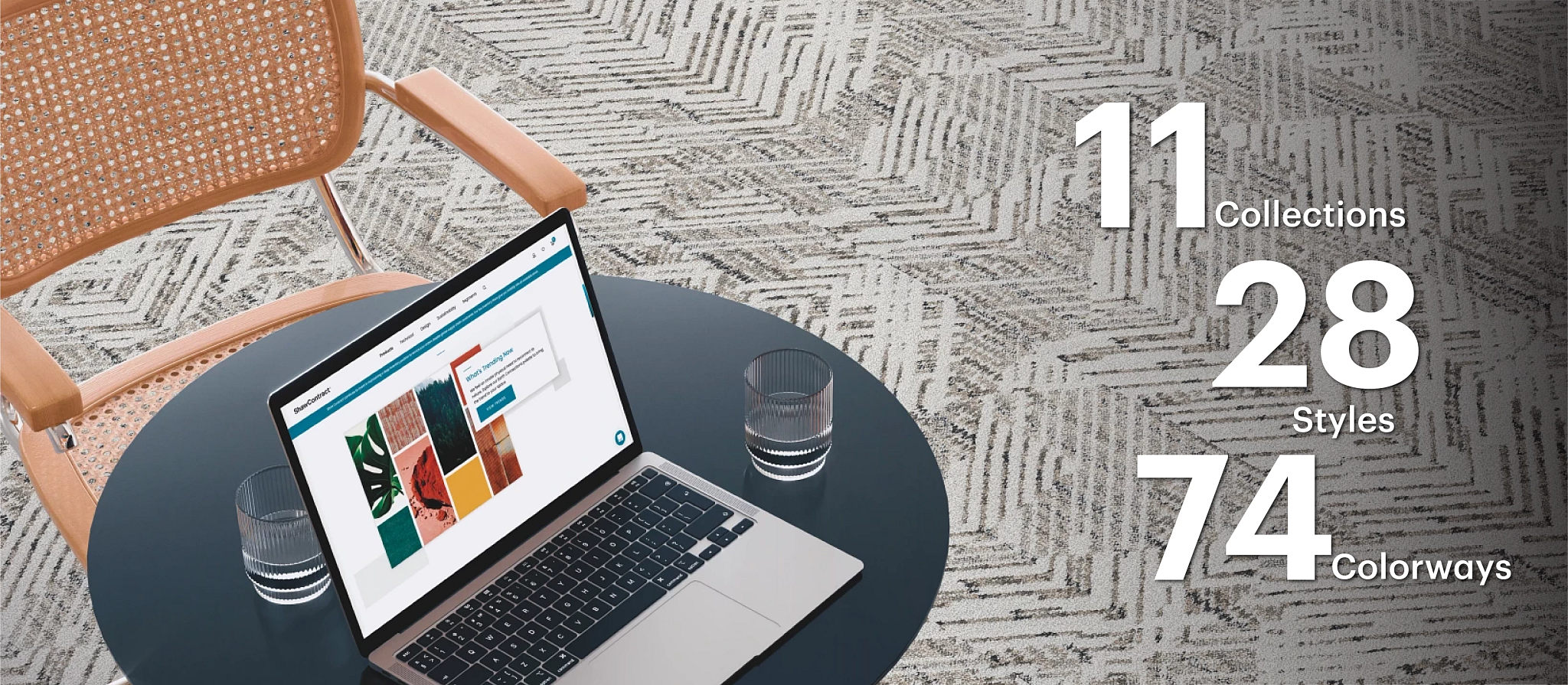 Contemporary office space with commercial carpet tile flooring and laptop on table Modern office setting with a laptop on a round table, showcasing a textured commercial carpet tile in a neutral color palette