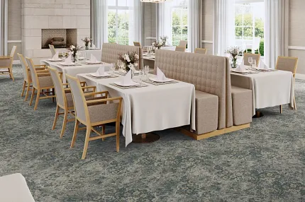 Sophisticated dining room with floral carpet flooring and elegant decor Elegant dining area with floral patterned carpet flooring, featuring beige upholstered chairs and white tablecloths
