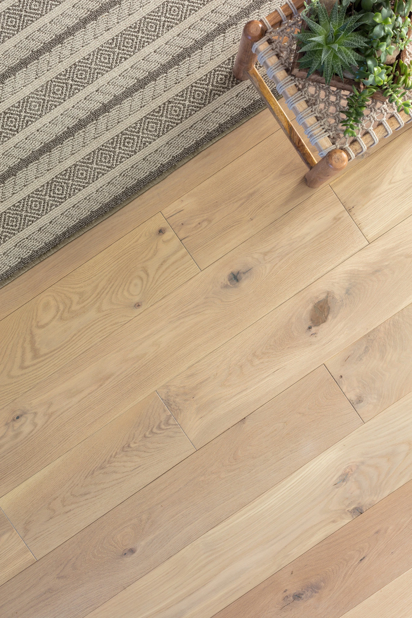 Natural oak hardwood flooring with visible knots and grain