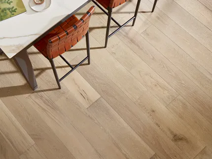 Premium Light Brown Hardwood Flooring for Modern Homes Elegant light brown hardwood flooring in a dining area with a modern table and leather chairs