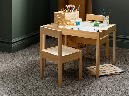 Comfortable and Durable Grey Carpet Flooring for Everyday Home Comfort Cozy children's playroom with durable grey carpet flooring and wooden table set