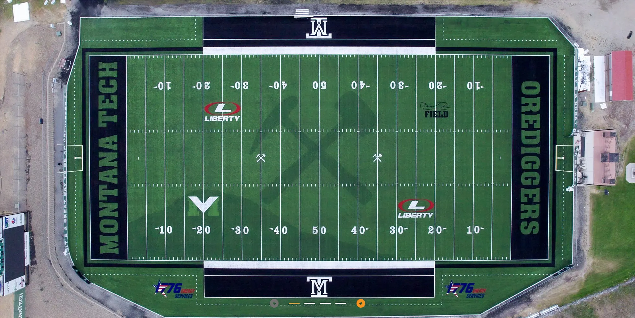 Aerial view of Montana Tech football field with artificial turf featuring logos and markings