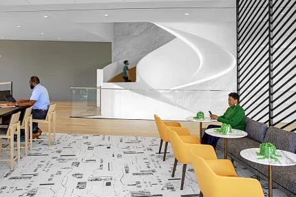 Contemporary Workplace Design with Abstract Flooring and Modern Furniture Modern workplace interior with abstract patterned flooring, yellow chairs, and a sleek white reception area