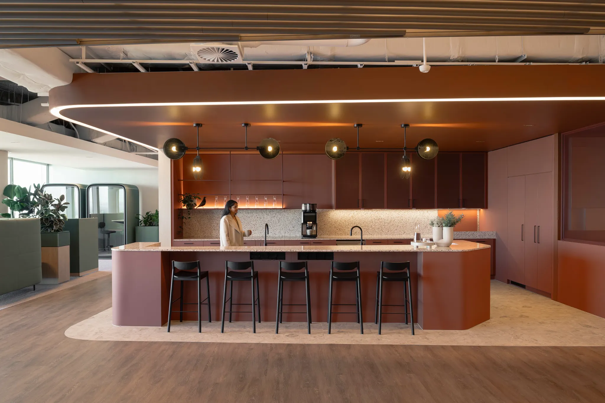 Modern office kitchen with wood flooring and contemporary design