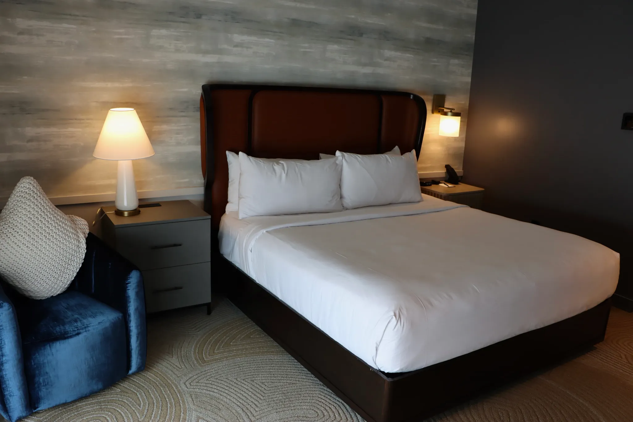 Modern hotel room with plush carpet flooring